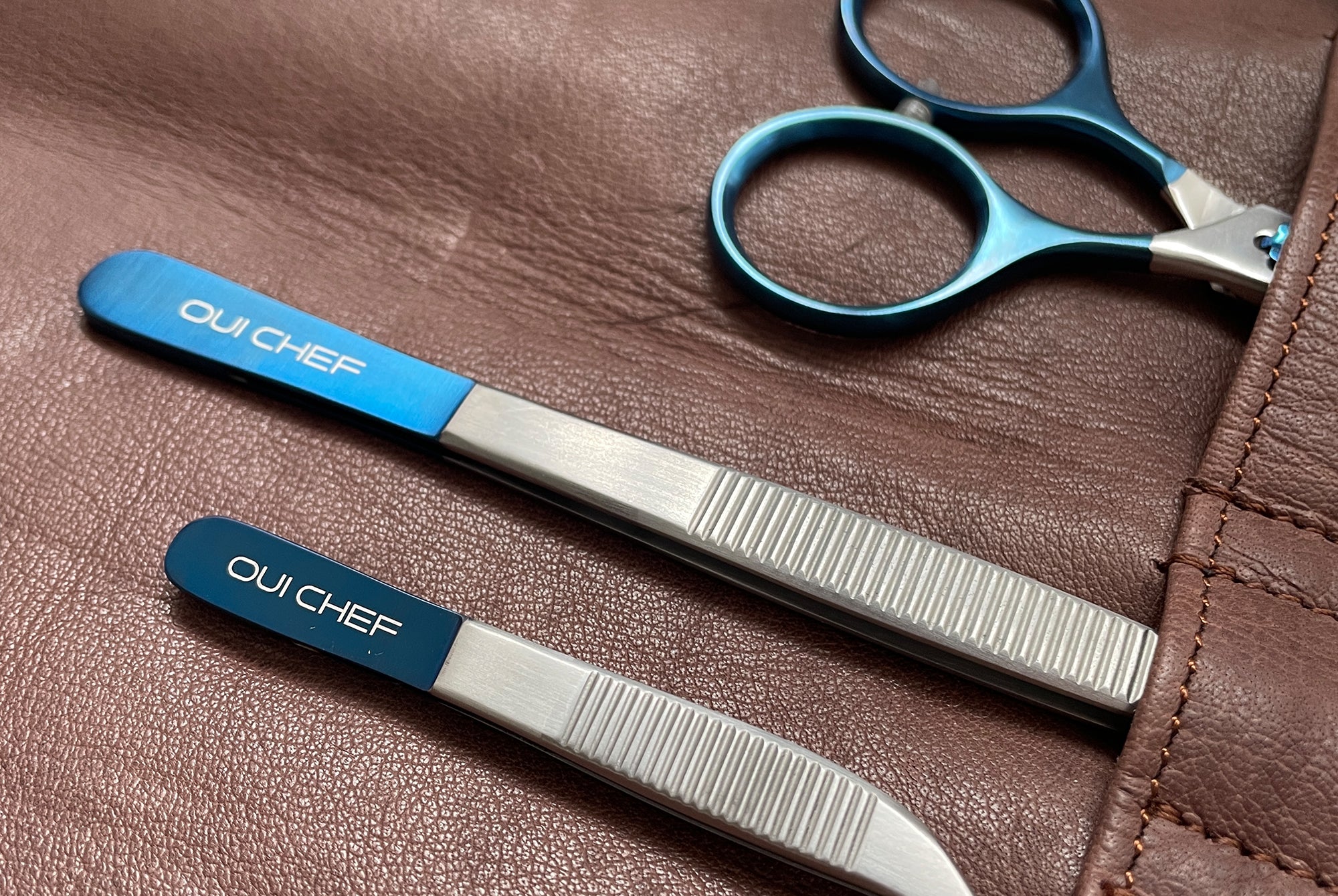 Oui Chef kitchen tools stored in leather brown knife roll