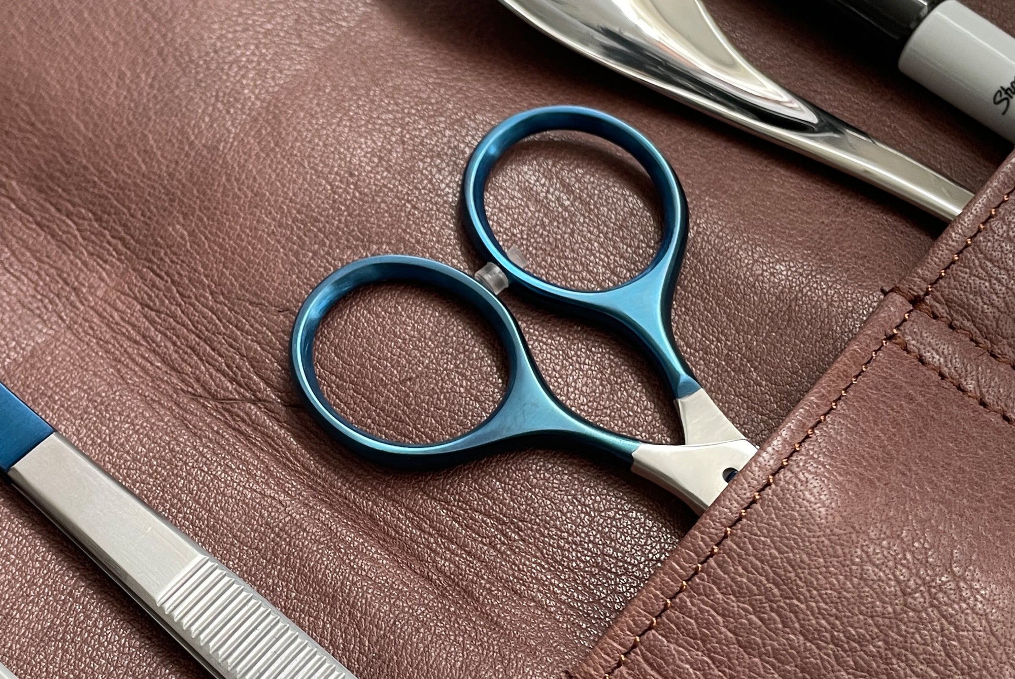 Oui Chef kitchen tools stored in leather brown knife roll