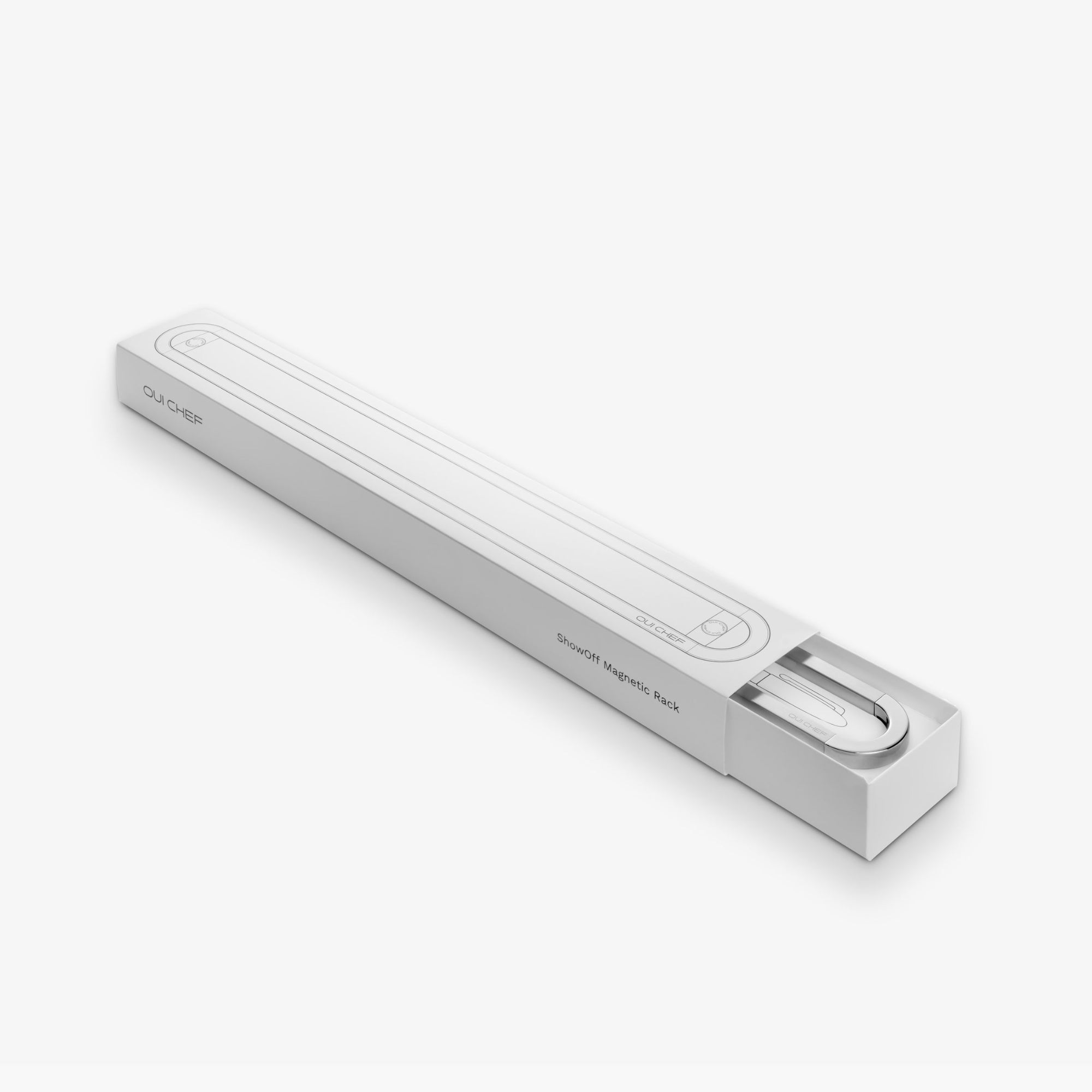 Stainless steel magnetic rack placed in the packaging against a white background.