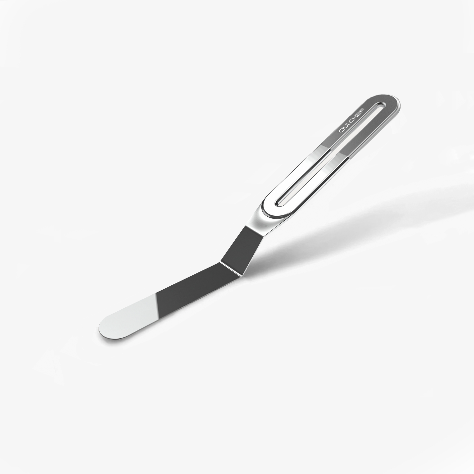 A small stainless steel palette knife with a chrome top handle with the "Oui Chef" logo engraved, sitting against a white background. 