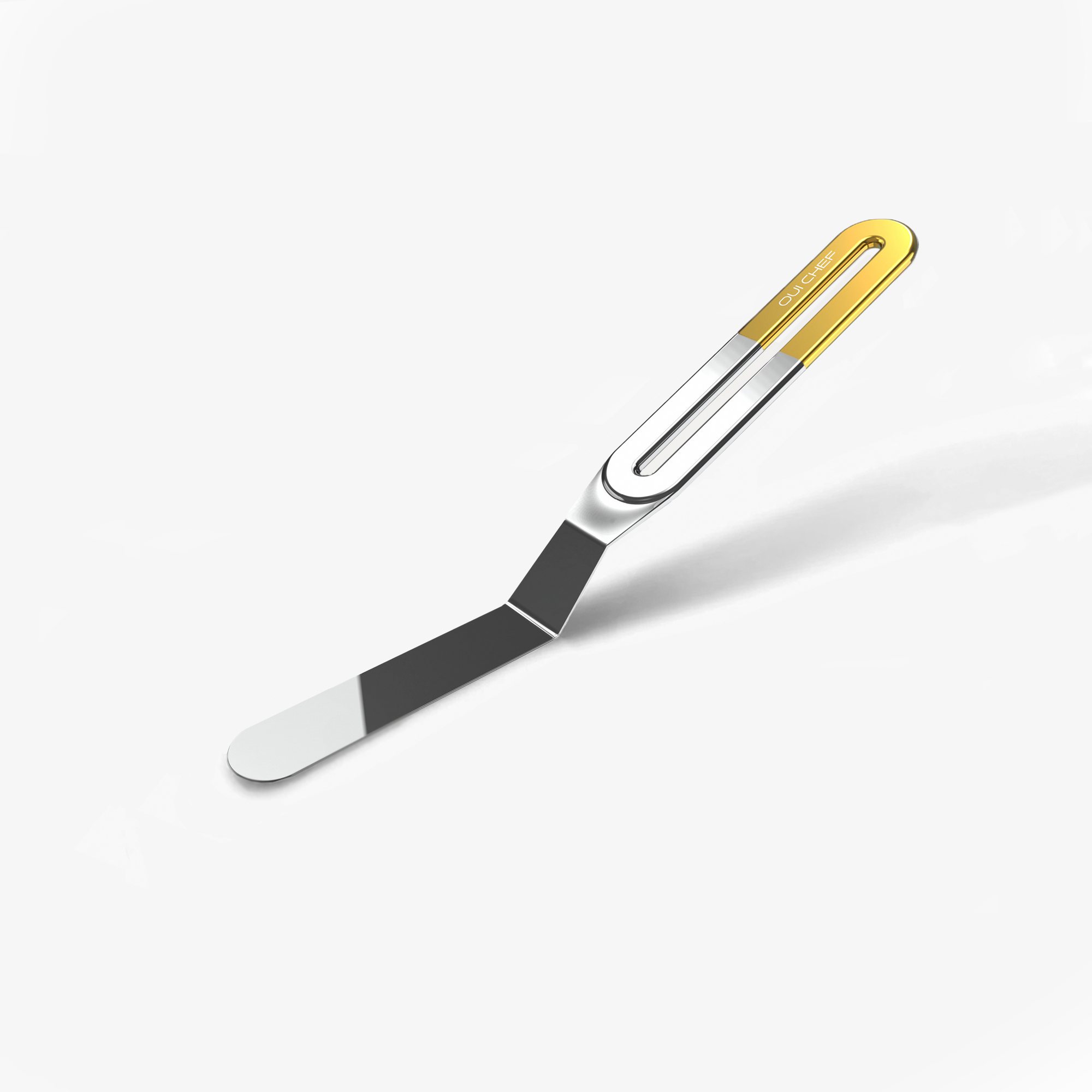 A small stainless steel palette knife with a gold top handle with the "Oui Chef" logo engraved, sitting against a white background. 